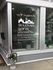 Inviting storefront of Sullivan Lofts on Jackson St., featuring beautiful floral accents and promoting senior living in a historic building.