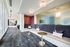 Elegant modern common area with plush seating, stylish decor, and ample natural light from large windows.