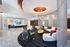 Modern lobby with elegant lighting, stylish seating, and a chic reception desk, creating a welcoming and luxurious ambiance.