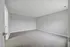 Spacious bedroom with plush carpet and neutral walls, perfect for customization.