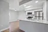 Modern kitchen with granite countertops, stainless steel appliances, and elegant lighting.
