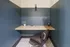 Modern workspace nook with minimalist design, featuring a sleek wooden desk, stylish leather chair, and elegant decor.