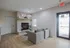 Inviting modern lounge area featuring cozy armchairs, a stylish fireplace, and elegant decor for a warm and welcoming atmosphere.