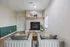 Inviting living room with cozy fireplace, modern decor, and plush seating creating a warm and stylish ambiance.