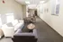 Bright, inviting communal lounge with comfortable seating and elegant decor, perfect for relaxation and social gatherings.