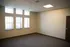Bright and inviting empty room with modern ceiling design and large windows offering abundant natural light.