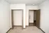 Sunlit bedroom with plush carpet, open closet, and neutral tones creating a serene ambiance.