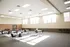 Spacious and bright community room with elegant tables, modern seating, and ample natural light.