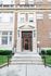 Charming vintage apartment entryway with elegant brick facade and classic architecture.