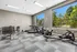 Modern fitness center with state-of-the-art gym equipment and serene outdoor views.