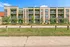 Charming modern apartment complex with spacious balconies and lush greenery, offering a serene living experience.