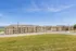 Charming apartment complex with modern architecture set against a bright, blue sky, offering a peaceful and welcoming environment.