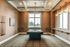 Elegant game room with a pool table, high ceilings, and large bright windows for natural light.