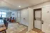 Charming living space featuring cozy seating and in-unit laundry, perfect for convenient modern living.