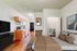 Cozy studio apartment with a modern kitchen, warm hardwood floors, and a spacious closet. Perfect blend of comfort and style.