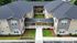 Modern apartment complex with dark shingled roof, landscaped courtyard, and elegant exterior design.