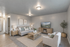 Elegant living room with modern decor, featuring cozy seating, stylish lighting, and a large TV for entertainment.