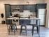 Stainless steel appliances, modern design table & chairs in kitchen at Incite at Troy | Downtown Troy Apartments