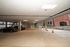 Spacious covered parking area with ample lighting and multiple parking spots, perfect for convenient and secure vehicle storage.