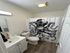 Charming bathroom with nautical-themed shower curtain featuring a classic diving suit design, modern sink setup, and stylish wood flooring.