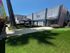 Inviting apartment complex featuring a charming outdoor area with gazebo seating, lush green lawn, and modern exterior design, perfect for relaxation and community gatherings.