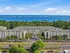Captivating coastal apartment complex offering stunning ocean views, lush green surroundings, and convenient urban access.