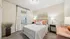 Inviting bedroom with elegant decor, plush bedding, and warm lighting, perfect for a cozy retreat.