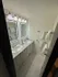 Elegant bathroom showcasing dual sinks, modern lighting, and luxurious marble flooring.