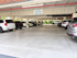 Spacious covered parking area with well-maintained concrete flooring and modern vehicles, ensuring secure and convenient parking for residents.