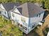 Charming two-story homes with modern design, spacious balconies, and surrounded by lush greenery for tranquil living.