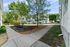 Charming apartment complex surrounded by lush greenery and well-maintained walkways.