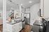 Modern kitchen with sleek stainless steel appliances, granite countertops, and elegant pendant lighting, offering a classy and functional space.