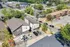Modern townhouse complex with ample parking set in a vibrant, tree-lined neighborhood.