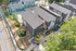 Chic modern apartments with sleek design and lush greenery, perfect blend of urban living and nature.