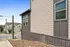 Charming neighborhood view with modern townhouses and well-maintained exterior in a sunny setting.