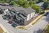Modern townhouse community with sleek architecture and lush greenery, offering suburban tranquility and urban convenience.