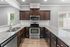 Modern kitchen with elegant granite countertops, sleek stainless steel appliances, and rich wood cabinetry.