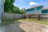 Charming backyard featuring a spacious patio and vibrant greenery, perfect for outdoor relaxation and entertainment.