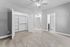 Inviting bedroom with plush carpet, spacious closet, and elegant ceiling fan; leads to a modern en-suite bathroom.