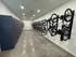 Modern bike storage room with sleek design featuring wall-mounted racks and secure lockers, ideal for urban living.