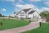 Charming suburban apartment complex with modern design nestled in lush green landscape under a vibrant blue sky.