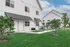 Charming modern townhouse exterior with pristine landscaping and inviting architecture.