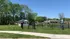 Charming park view featuring a quaint gazebo, manicured lawns, and tranquil surroundings in a peaceful neighborhood.
