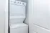 Efficient in-unit laundry area featuring a sleek white stackable washer and dryer, perfect for convenient living.