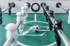 Dynamic foosball table with a soccer ball in play, showcasing a lively recreational feature in a modern apartment setting.