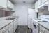 Contemporary kitchen with modern appliances, ample cabinet space, and sleek countertops.