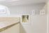 Bright utility area featuring modern outlets and a sleek countertop, designed for convenience and style.