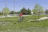 Vibrant outdoor scene featuring a cyclist enjoying a sunny day in a lush green park.