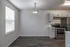 Inviting kitchen with modern appliances, sleek cabinetry, and elegant lighting, perfect for culinary enthusiasts.