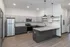 Modern kitchen design featuring sleek stainless steel appliances, granite countertops, and stylish pendant lighting.